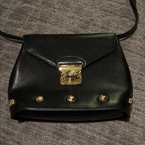 Authentic Ferragamo Black Leather Shoulder Bag with Gold Accents
